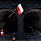 A Polish flag waves in front of a crematorium oven at the former site of the Gusen death camp in Austria, which Warsaw is pushing to be memorialised