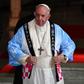 Pope Francis tries on a Japanese souvenir shirt