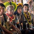 Indigenous tribesmen listen to Raoni chief Metuktire (out of frame) during a press conference in Piaracu village, near Sao Jose do Xingu, Mato Grosso state, Brazil