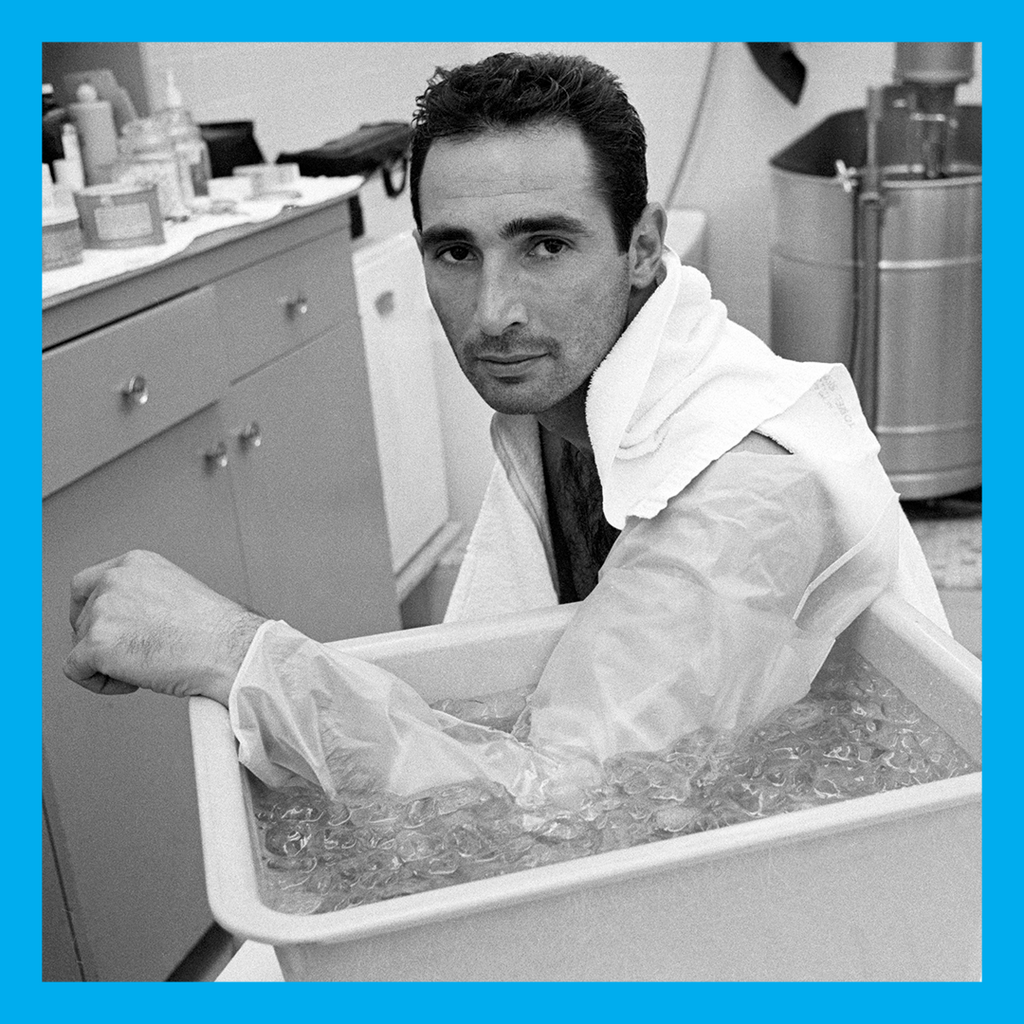 <strong>SANDY KOUFAX</strong> with his left arm in ice.