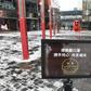 A sign urges visitors to wear face masks at the entrance to an empty shopping mall in Beijing