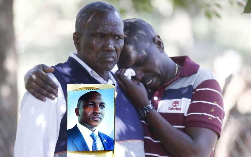 Kipyegon Kenei's father, John Chesang with a relative in Nakuru. 'Suicide note' found with Sergeant Kenei's body was not in his handwriting - DCI detectives say