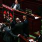 Security officials were called in to force out pro-democracy lawmakers who shouted slogans and held placards criticising Hong Kong's leader Carrie Lam