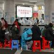 Medical facilities in the Chinese city of Wuhan are swamped with patients waiting for hours to see doctors