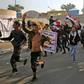 Iraqi supporters of the Iran-trained Hashed al-Shaabi paramilitary force join protesters in Baghdad's Tahrir Square in what is widely seen as an act of intimidation