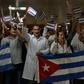 Doctors wait for fellow medical personnel returning from Bolivia at the Jose Marti International airport in Havana on November 16, 2019