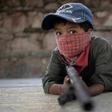 Children in Ayahualtempa train with rifles or makeshift guns to join the fight against drug cartels