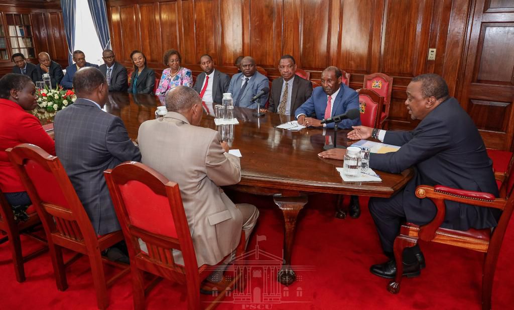 President Uhuru Kenyatta with KIST Board of Trustees. Treasury CS Ukur Yattani receives title deed to controversial Kiambu Institute of Science and Technology (KIST) land in Kiambu