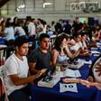 A woman with a baby collects a government-issued food card in Lomas de Zamora, close to the capital Buenos Aires