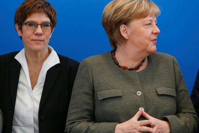 Annegret Kramp-Karrenbauer (l) was designated successor to German Chancellor Angela Merkel before their CDU party unleashed an earthquake in national politics by voting with the far-right AfD