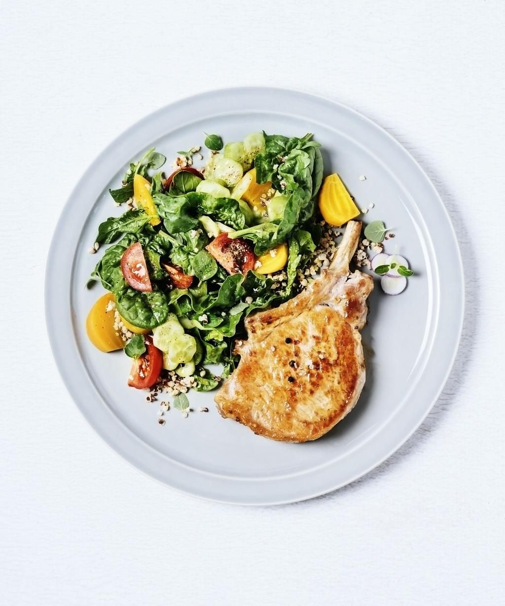 Roasted pork chop with salad