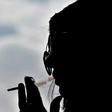 Saudi woman Heba smokes a cigarette at a cafe in Riyadh