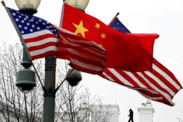 Chinese and US flags fly from a lampost near the White House in Washington. Beijing says a recent decision by the US to expelled two Chinese embassy officials was a 'mistake'