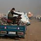 Syrians carrying their belongings have been fleeing the southern Idlib region toward the north amid heavy bombardment