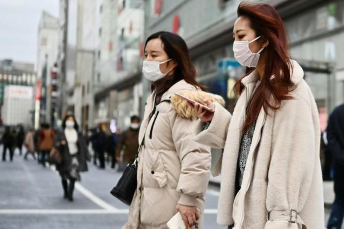 Japan has imposed new checks on travellers arriving from China