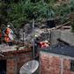 Rescue workers looked for victims after two houses collapsed during record rainfall in southeastern Brazil