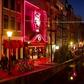 Amsterdam is looking at moving part of its famed red light district (pictured 2011) to an indoor complex that could include a bed and breakfast for prostitutes as well as a sex club, sex theatre and cafes