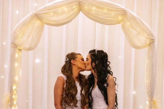 Robyn Peoples (L) and Sharni Edwards (R) tied the knot at a hotel near Belfast, after the new legislation came into effect on Monday