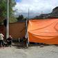 Opponents of Bolivian ex-president Evo Morales camp at the entrance of the La Rinconada gated community in La Paz, where the Mexican embassy is located and where some members of Morales' government have taken refuge