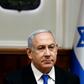 Israeli Prime Minister Benjamin Netanyahu has agreed to step down from all of his ministerial posts by the end of the year, but campaigners say he should give up the premiership too following his indictment on corruption charges last month