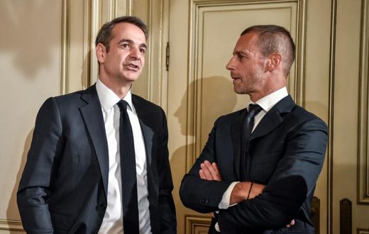 Greek Prime Minister Kyriakos Mitsotakis (L) with UEFA president Aleskander Ceferin