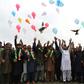Afghan youths release balloons and pigeons as they celebrate the reduction in violence so far