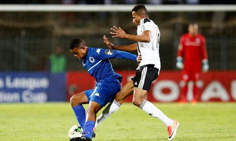 A file photo of SuperSport United midfielder Sipho Mbule (L), who scored the only goal in a South African Premiership match against Bidvest Wits in Johannesburg Friday
