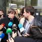 Former Catalan regional president Carles Puigdemont (C-L) and his health minister Toni Comin (C-R) talk to the press after receiving their badges as accredited members of the European Parliament on December 20, 2019 in Brussels