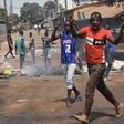 Protesters burn rubbish and block roads along the "axis of democracy" as demonstrations broke out in Conakry in February 2020 after Guinea's President Alpha Conde postponed a parliamentary election