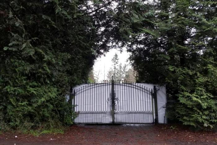 A shielded gate at the entrance of Meghan and Prince Harry's temporary home in North Saanich, Canada