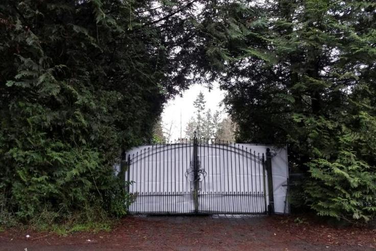 A shielded gate at the entrance of Meghan and Prince Harry's temporary home in North Saanich, Canada
