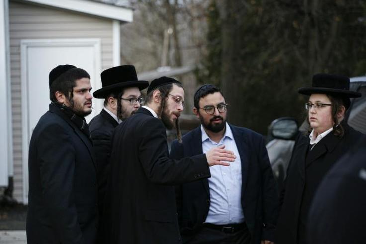Members of the Jewish community gather outside the home of rabbi Chaim Rottenbergin Monsey, in New York on December 29, 2019 after a machete attack that took place earlier outside the rabbi's home during the Jewish festival of Hanukkah