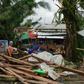 Typhoon Phanfone swept across the central Philippines on Christmas Day, tearing roofs off houses