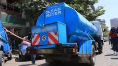 A water bowser delivers water in the city centre