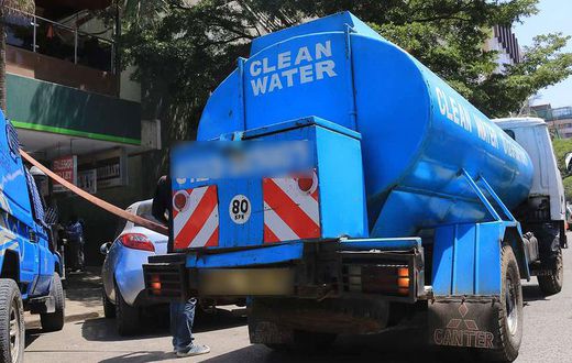 A water bowser delivers water in the city centre