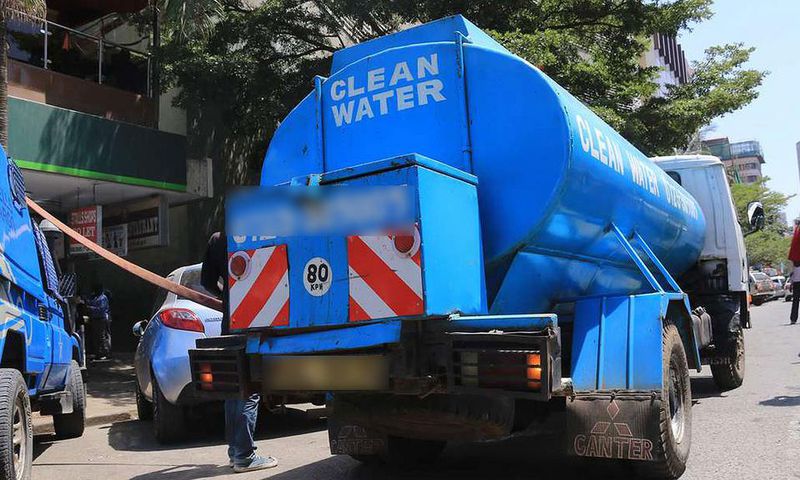 A water bowser delivers water in the city centre
