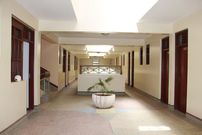 An image depicting an empty hotel hallway