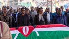 Winnie Odinga, Rosemary Odinga, Ida Odinga, Oburu Odinga and his wife standing next to the casket carrying the body of former Prime Minister Raila Odinga at Nyayo Stadium on October 17, 2025