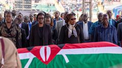 Winnie Odinga, Rosemary Odinga, Ida Odinga, Oburu Odinga and his wife standing next to the casket carrying the body of former Prime Minister Raila Odinga at Nyayo Stadium on October 17, 2025