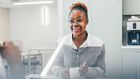 A woman in an office kitchen