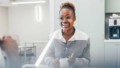 A woman in an office kitchen