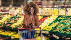 A black woman shopping at a supermarket