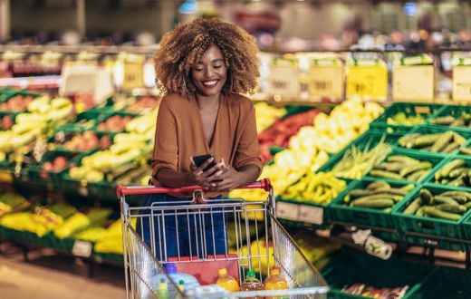 A black woman shopping at a supermarket