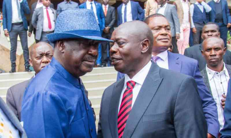 File image of ODM leader Raila Odinga chats with former DP Rigathi Gachagua at KICC, Nairobi on July 9, 2024