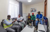 President William Ruto with a resident of the Mukuru Housing Units