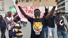 A protestor holding a placard during the ant-Finance Bill protests led by the Gen-Zs on June 25th,2024 in Nairobi.