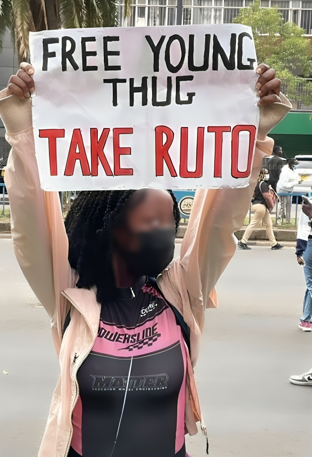 A protest holding a placard during the ant-Finance Bill protests led by the Gen-Zs on June 25th,2024 in Nairobi.