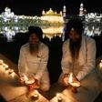 Devotees light lamps on the 399th birth anniversary of the ninth Guru, Teg Bahadur, at the  Golden Temple in Amritsar
