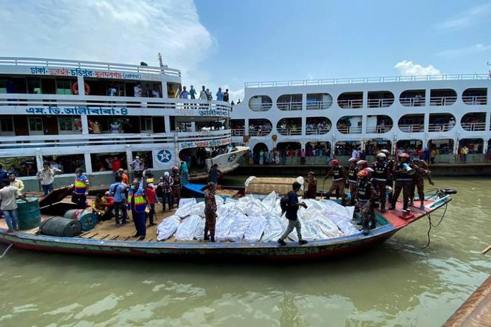 Divers were still pulling bodies from the wreck, with the deceased placed in body-bags and then laid in rows at the harbour-front