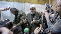 Russian historian Yury Dmitriyev (pictured April 2018), who heads rights group Memorial's branch in Karelia, speaks to the media as he leaves a court following the verdict in his child pornography trial in the northwestern city of Petrozavodsk